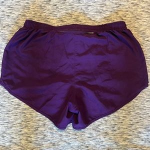 Purple Nike running shorts, L